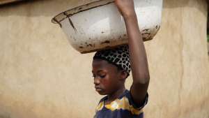 Portrait of a Ghanaian child porter