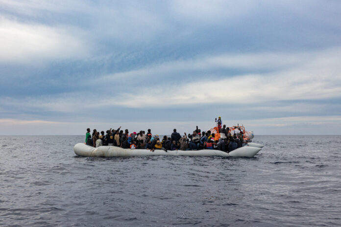 a boat filled with migrants in the Mediterranean sea