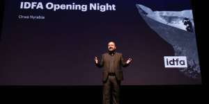 orwa nyrabia speaking at the opening of 2023 idfa