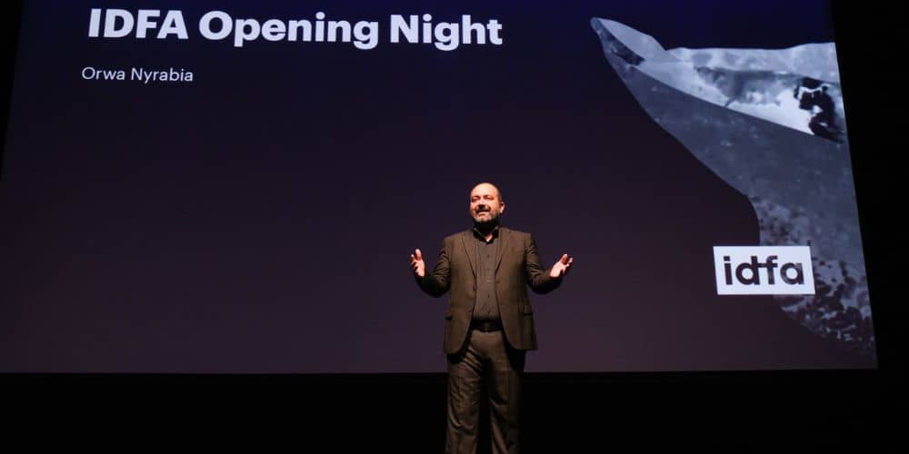 orwa nyrabia speaking at the opening of 2023 idfa