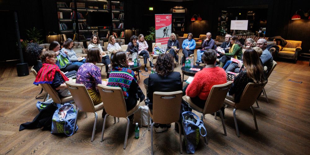 a crowd sitting in a circle for the CIRCLE Womens Documentary Accelerator programme