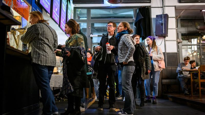 a group buying tickets at the Verzio Film Festival