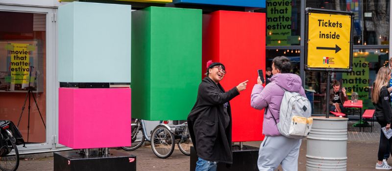 two fans standing outside movies that matter festival