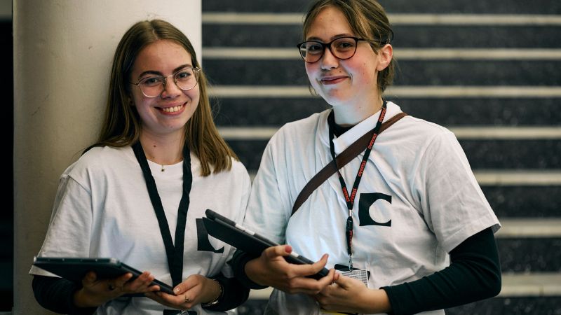 two volunteers working at the One World Documentary Film Festival in Prague